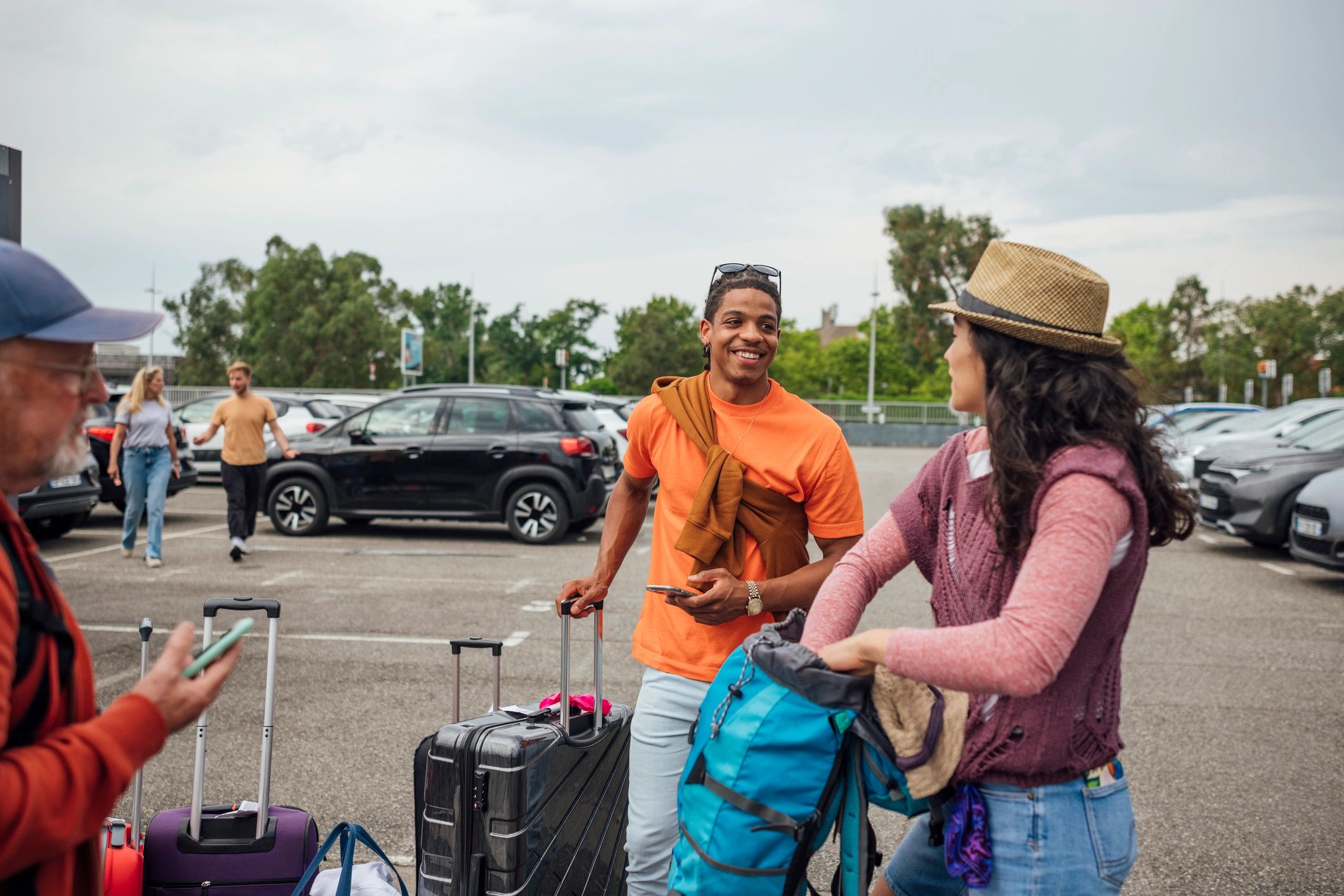 Happy travelers beginning their journey at the airport
